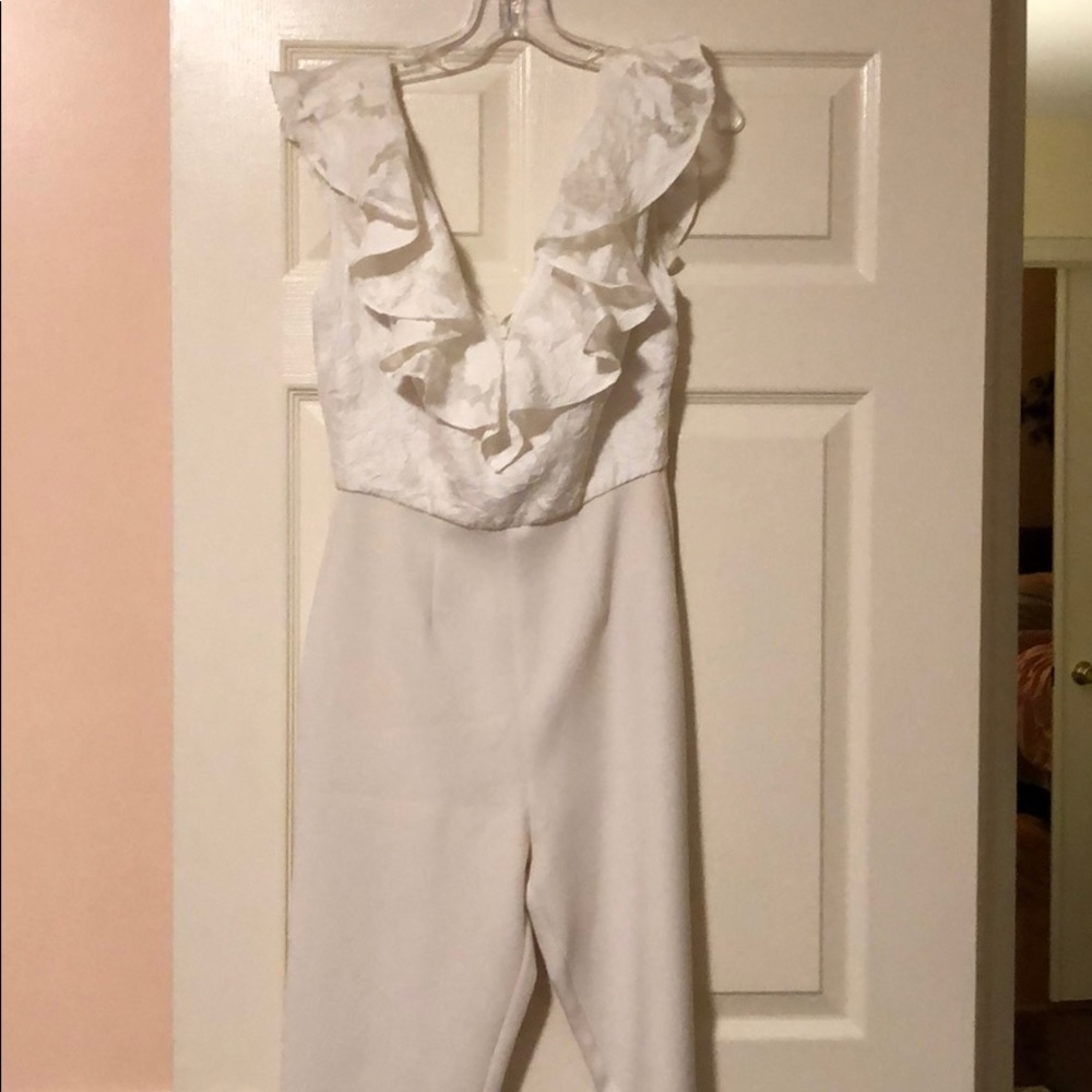 White jumpsuit with ruffle lace v-neck